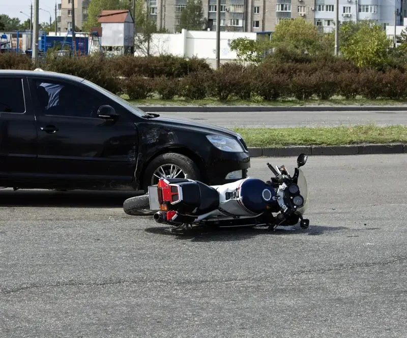 crash moto bike and car on road